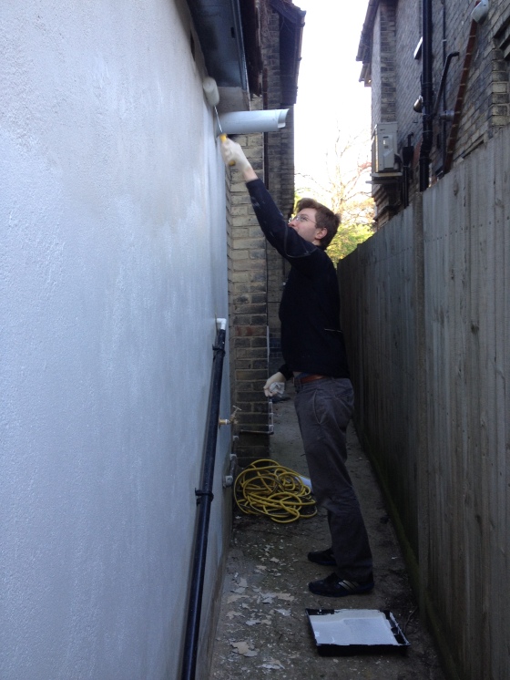 Dan painting the wall